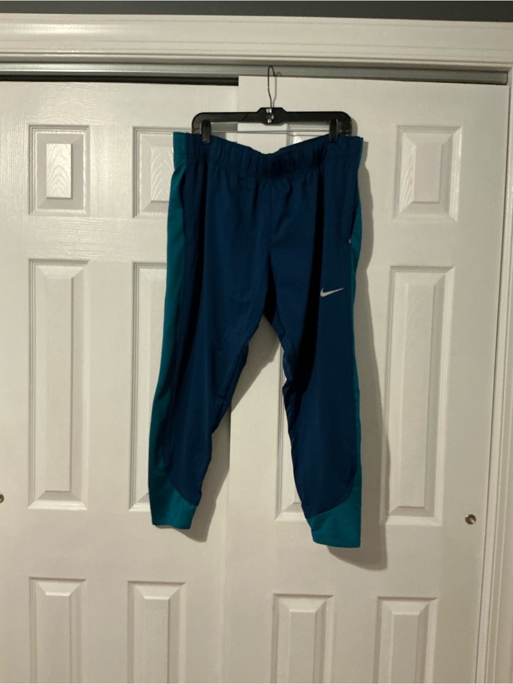 Nike Kids' Dark Blue Joggers with Teal Side Panels